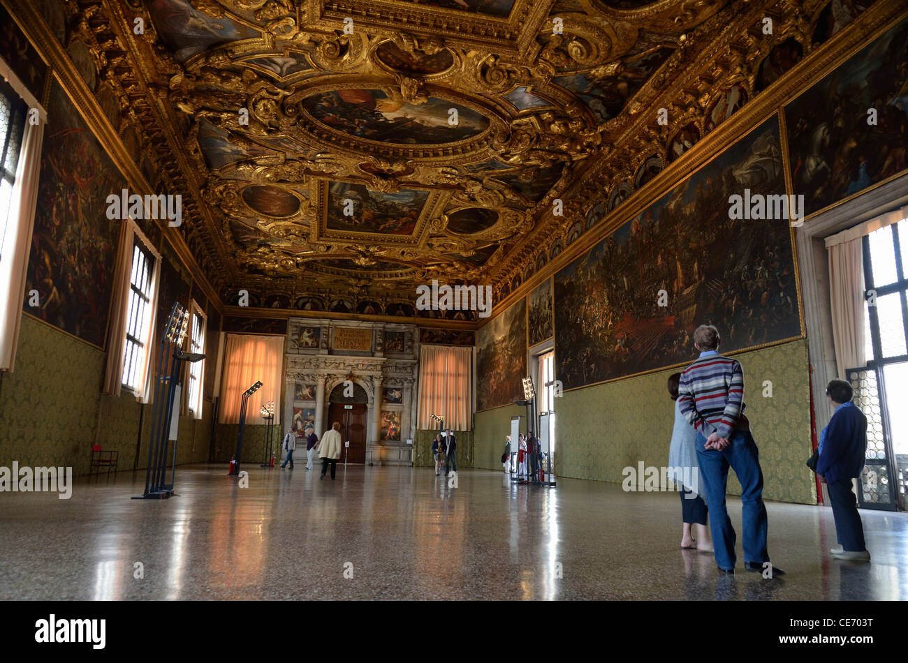 Doges Palace, Venice : Tourists in the Hall of Collegio with 'The Battle of Lepanto' by Andrea Vicentino (right) Stock Photo