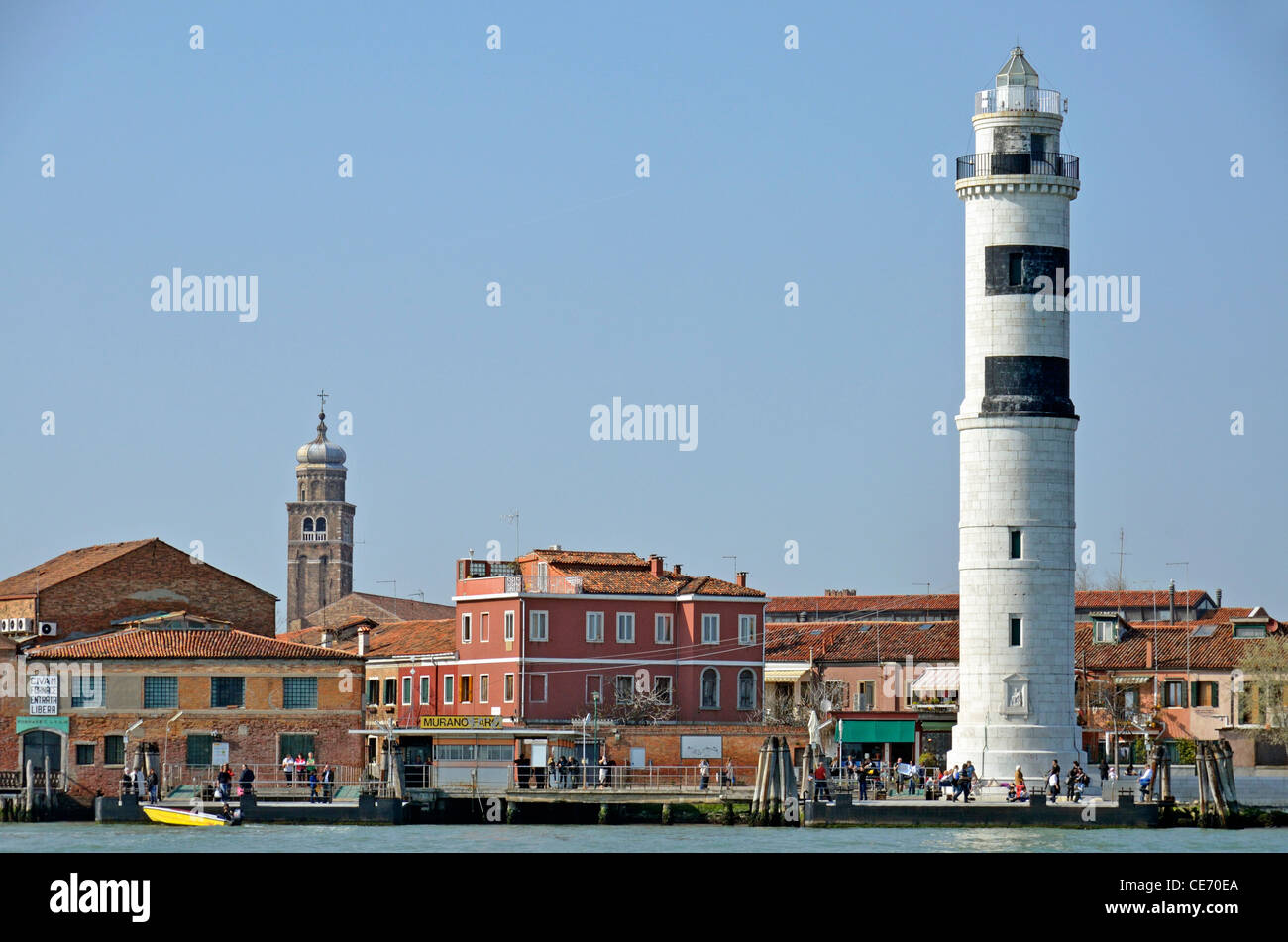Murano Island lighthouse, San Pietro Martire church in the background, Venice, Italy Stock Photo
