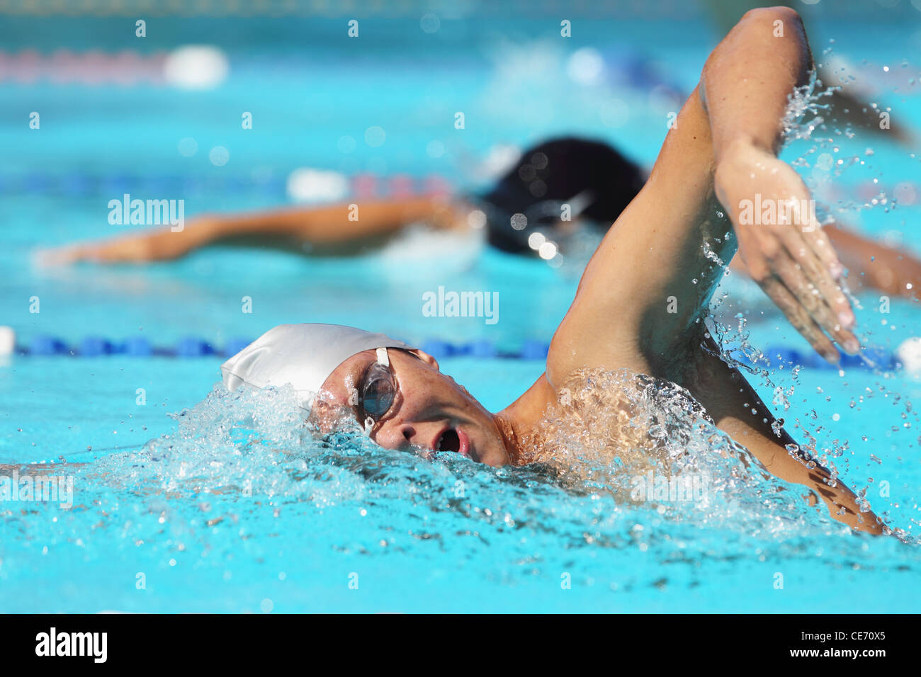 Swimmers Competing in Pool Stock Photo