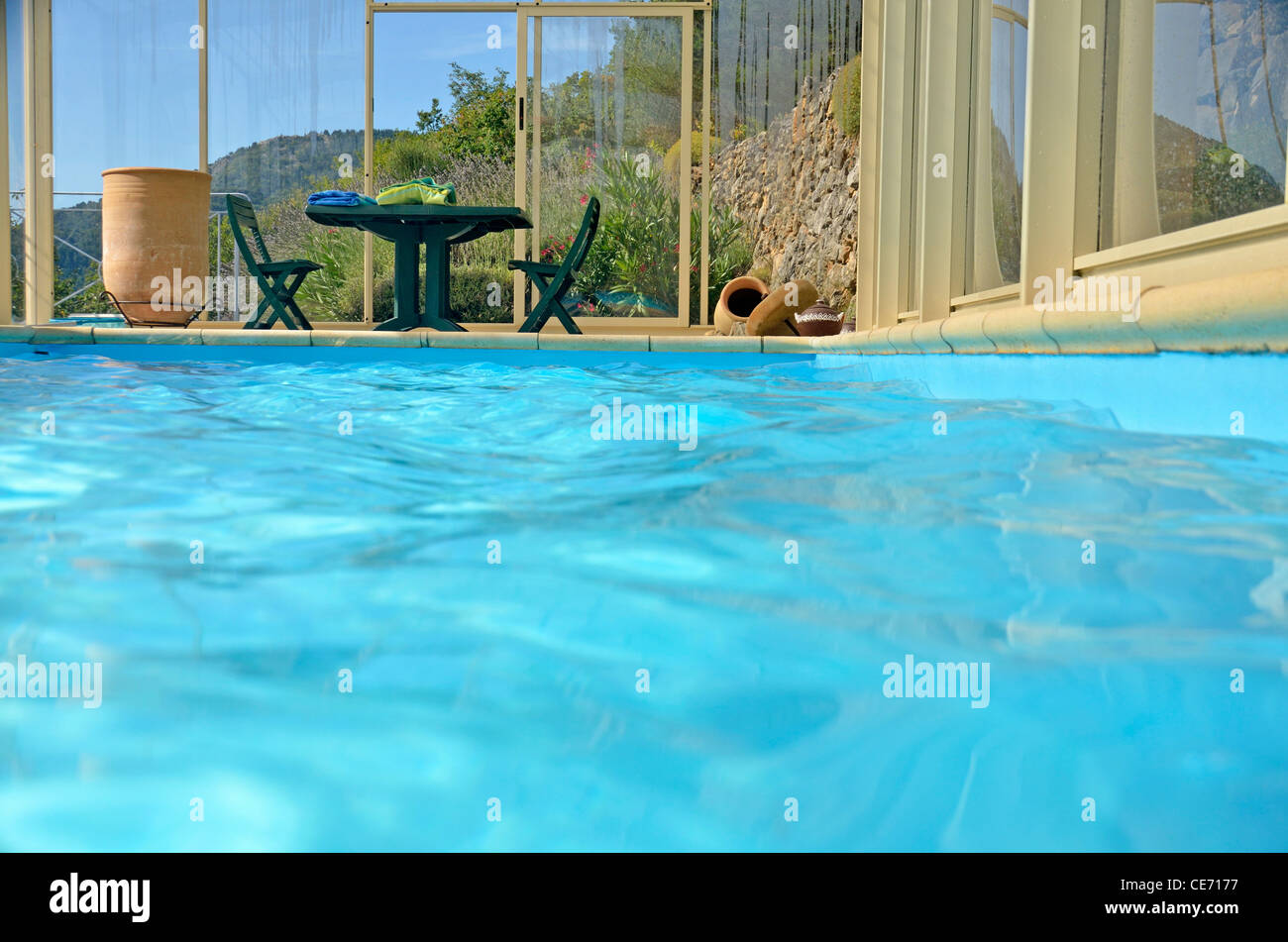 Luxury indoor swimming pool in the mountains in the summer holiday season Stock Photo