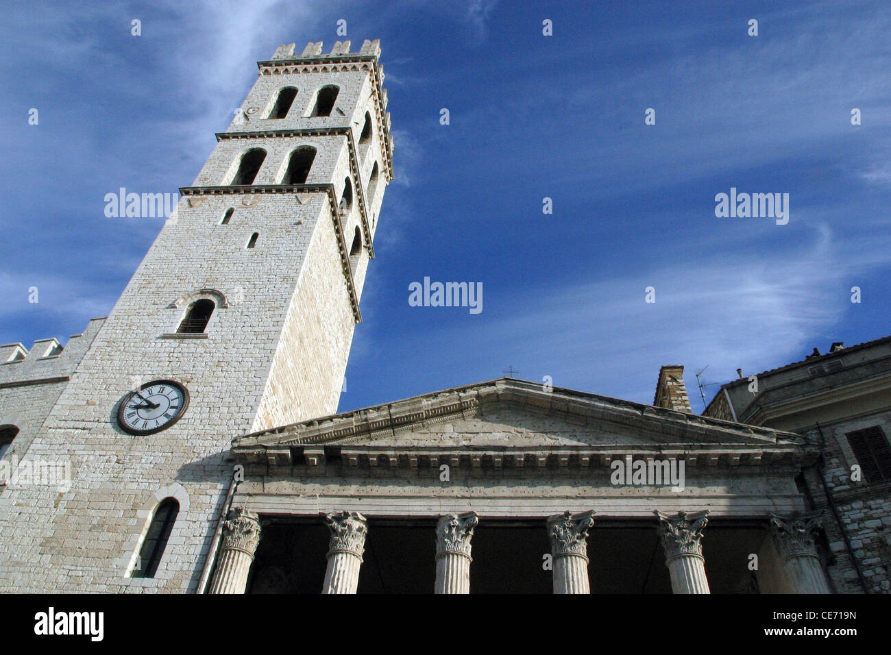 The Square of Comune (Piazza del Comune) is in the centre of Assisi.The tower of the Temple of Minerva Stock Photo