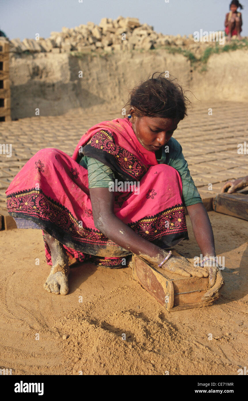 Woman making bricks ; jaunpur ; uttar pradesh ; India Stock Photo