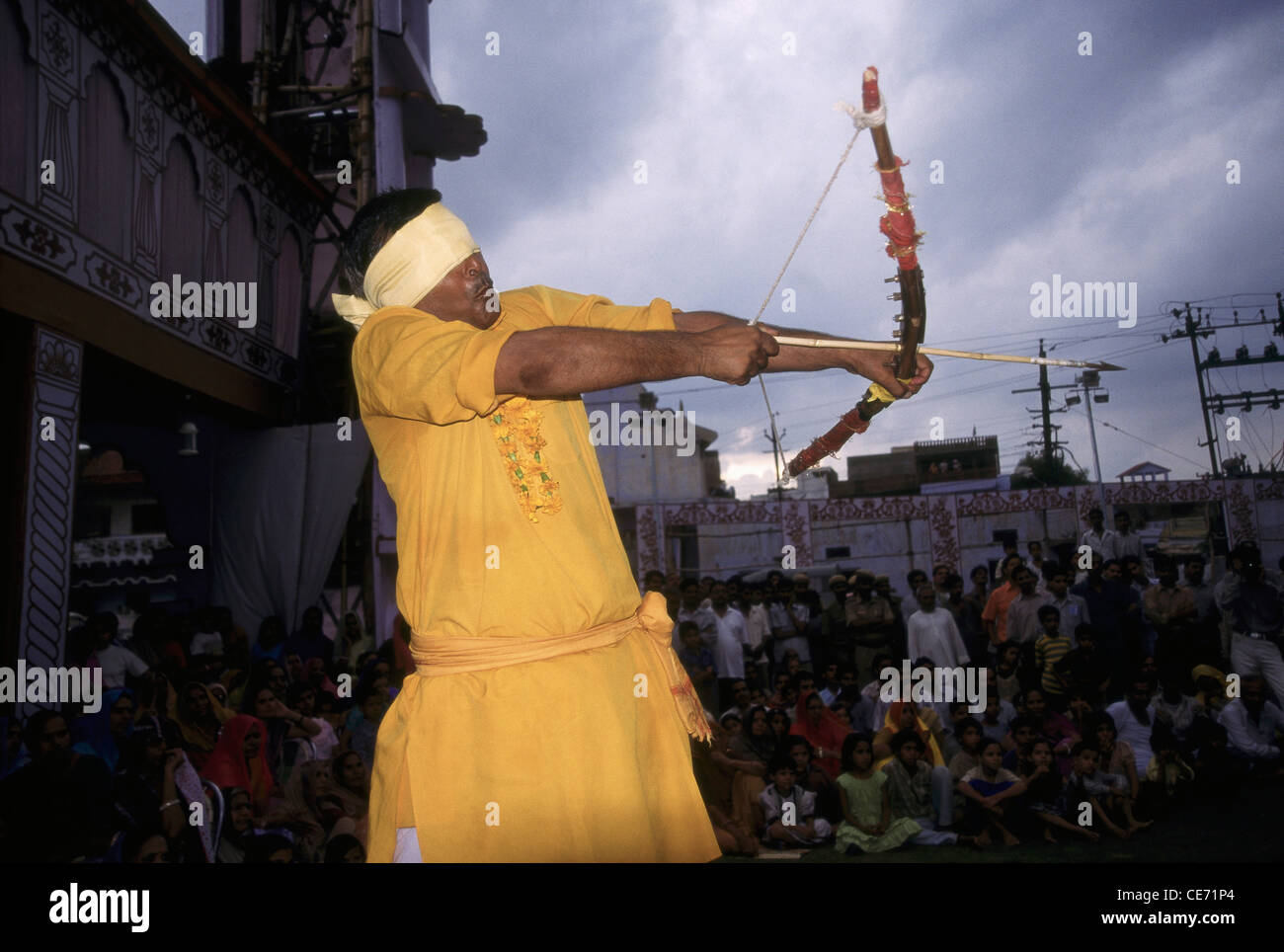 SNS 81694 : blind folded man shooting bow and arrow ; jaipur ; rajasthan ; india Stock Photo