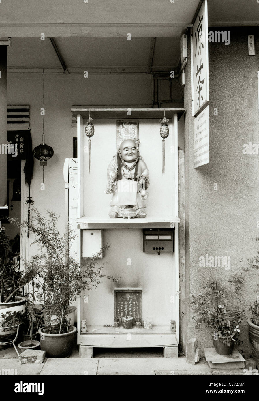 Travel Photography - Small Buddhist street shrine in Geylang in Singapore in Southeast Asia Far East. Buddhism Religion Religious Stock Photo