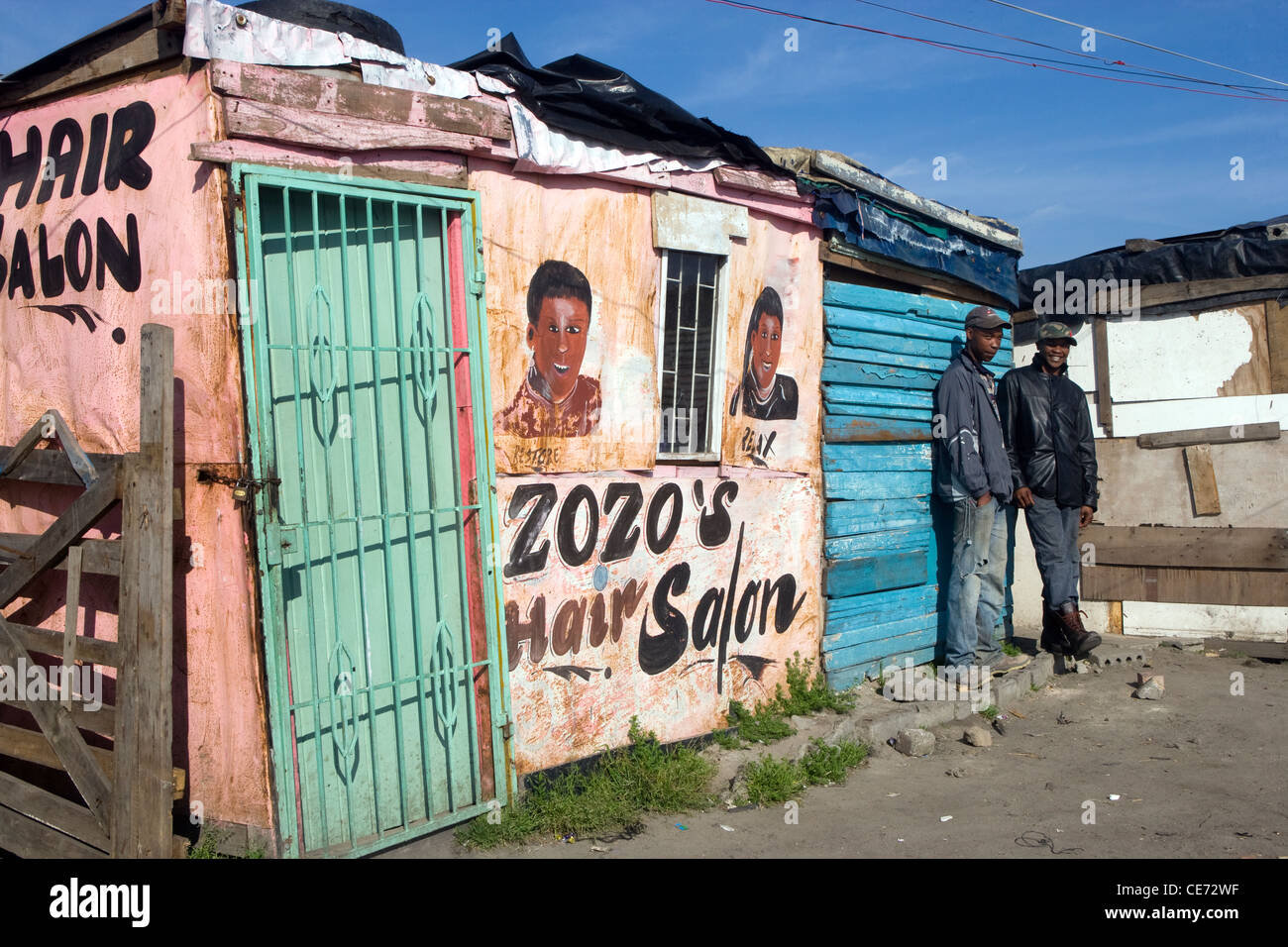 Cape Town Langa Township locals outside hair salon Stock Photo