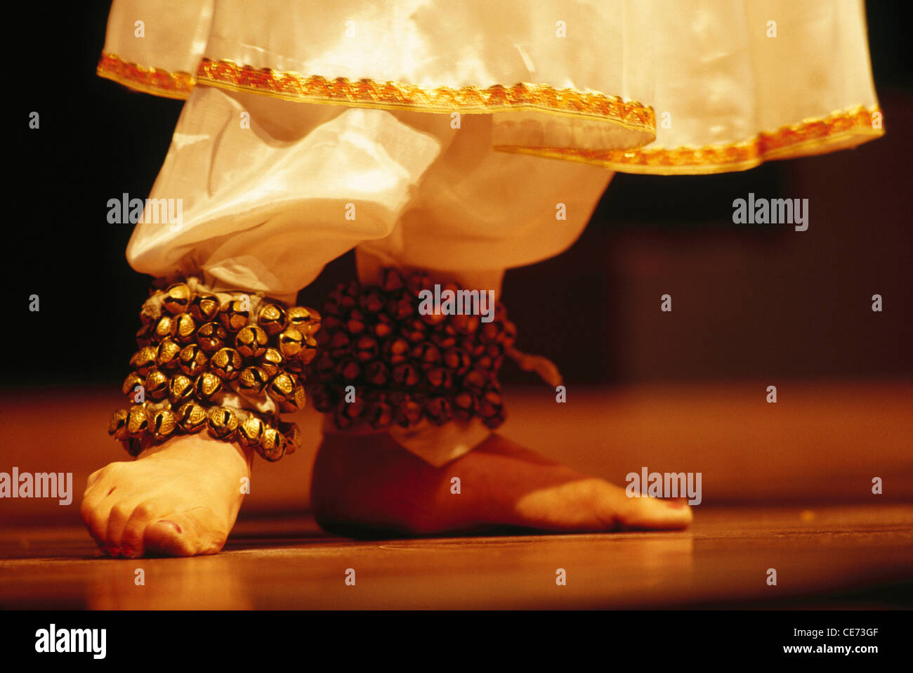 Indian classical dance Kathak wearing ghungroo jingling ankle bells ; india ; asia Stock Photo