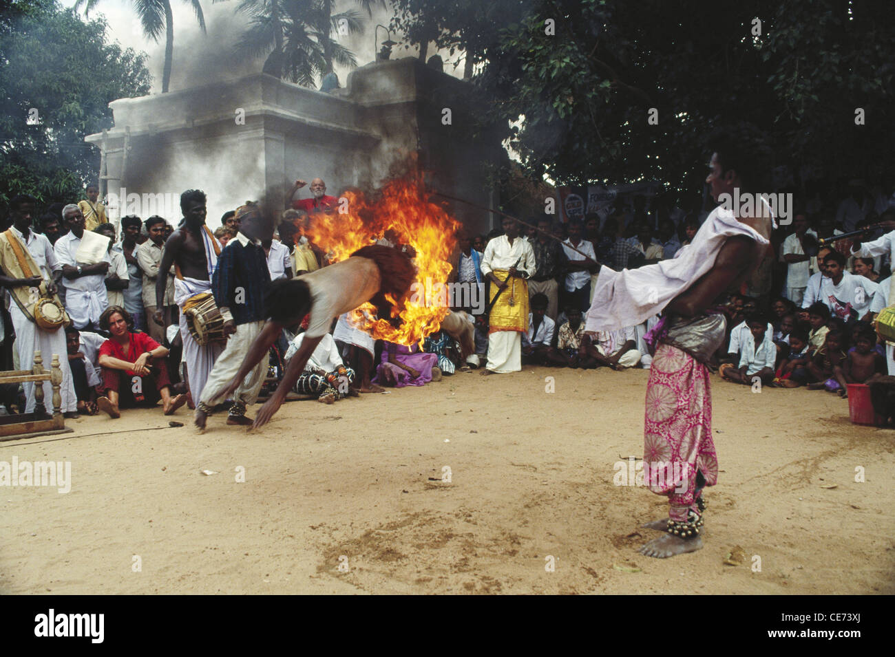 MAA 84419 indian man jumping through fire ring flames ; madurai