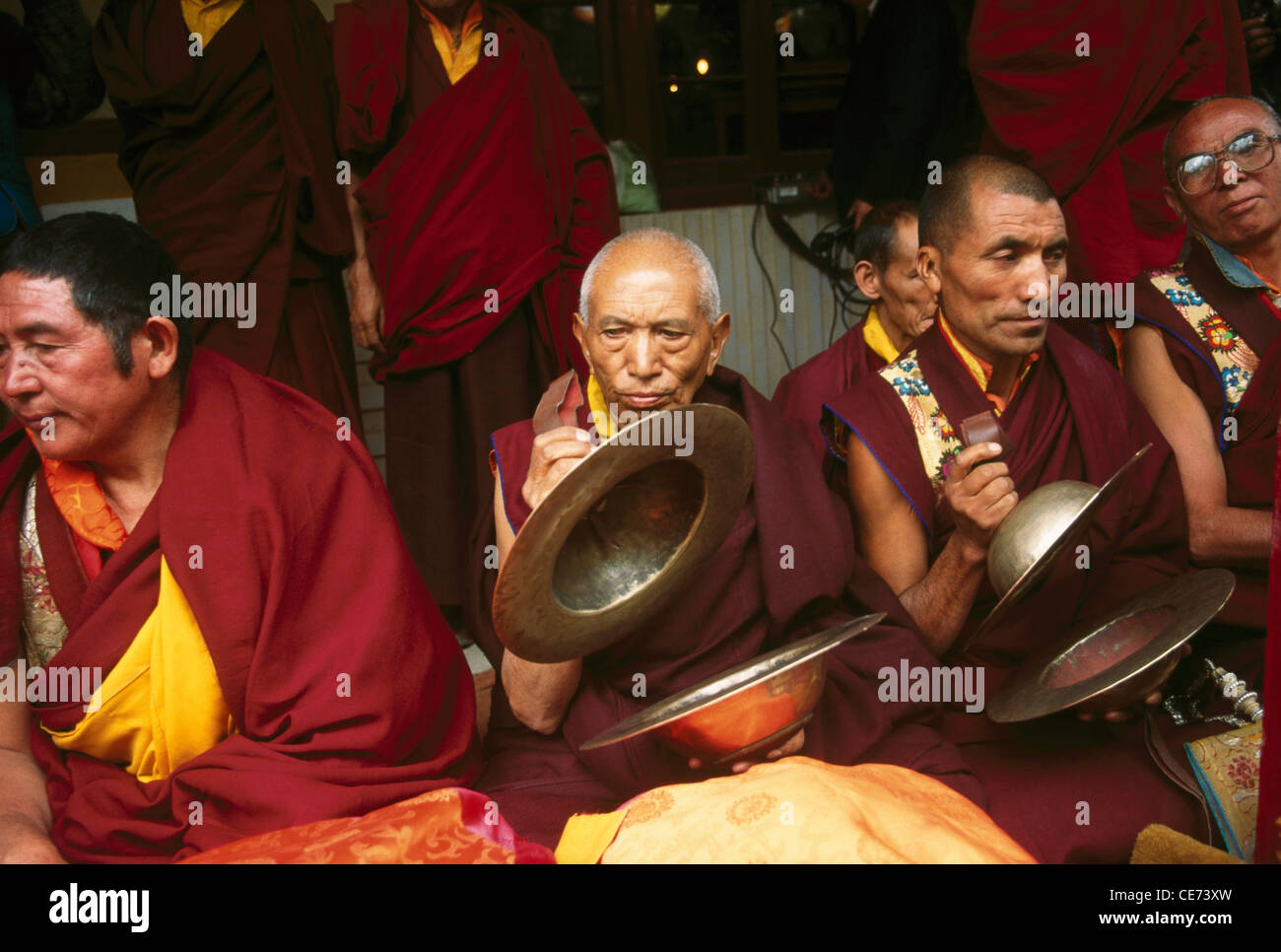 SSK 82713 : buddhist monks playing musical instrument cymbols ; ladakh festival ; Jammu and Kashmir ; india Stock Photo