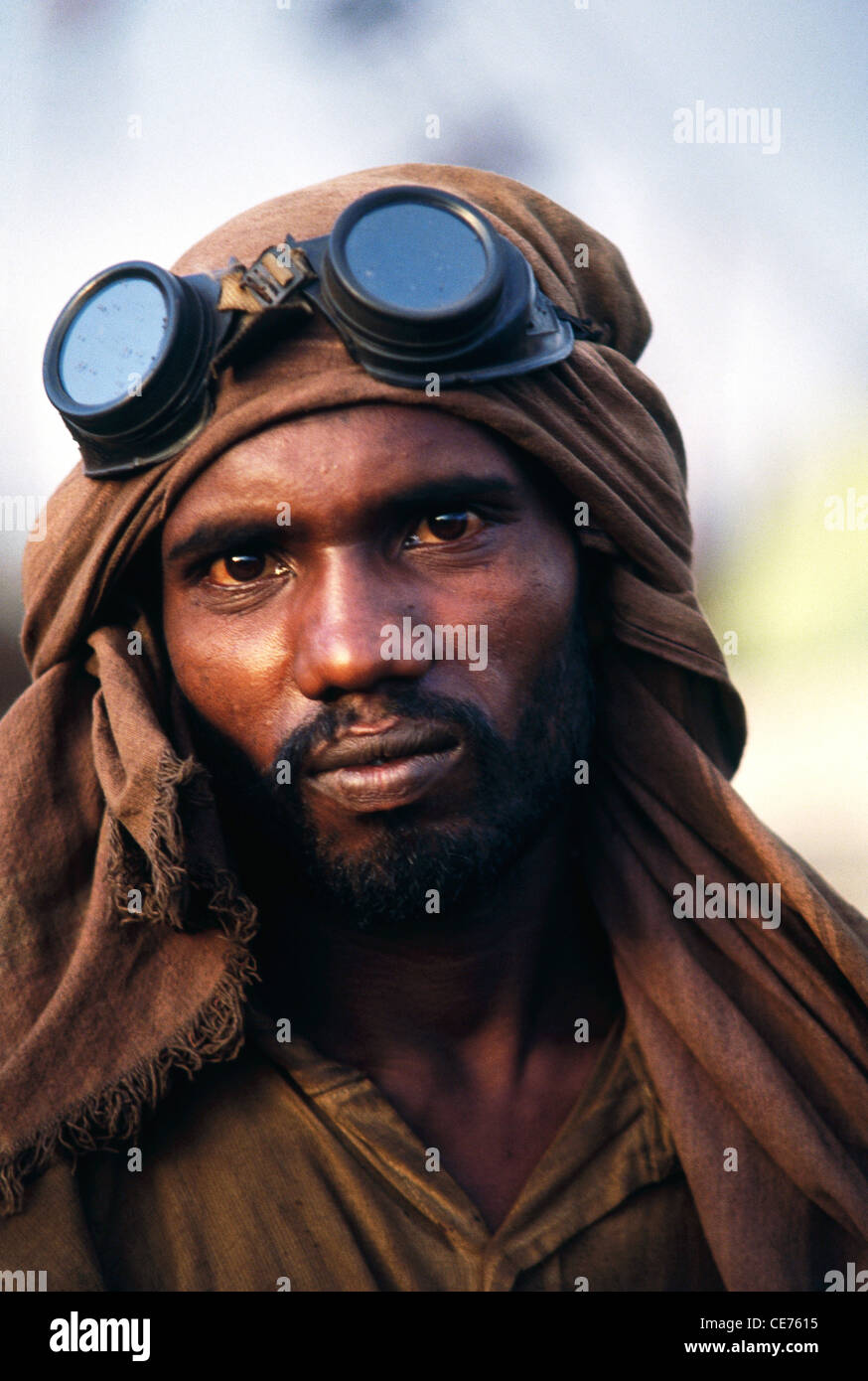 Indian man with safety goggles working in Alang ship breaking yard ; Bhavnagar district ; gujarat ; india ; asia Stock Photo