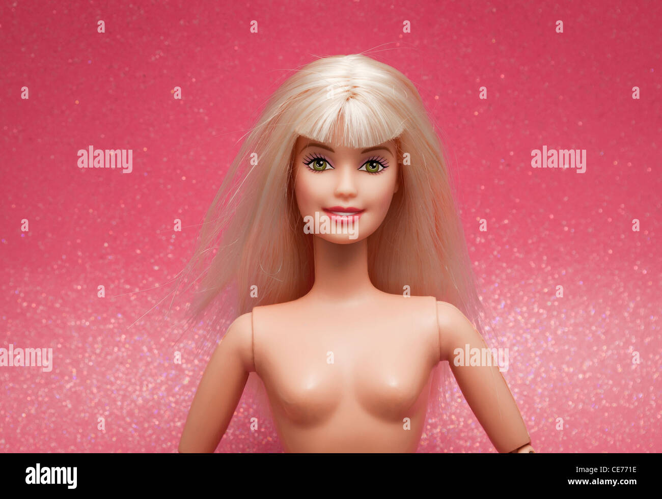 consultant Theoretical boss A typical Barbie doll, nude, against a pink sparkly background Stock Photo  - Alamy