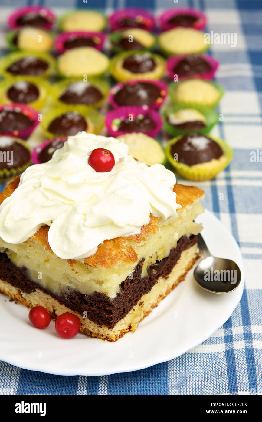 Homemade pie with whipped cream and muffins Stock Photo