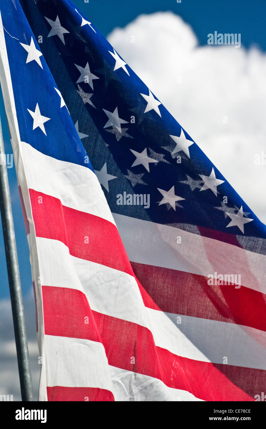 United States flag against a blue sky Stock Photo - Alamy