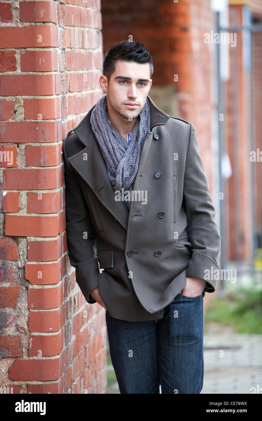 Male model striking a pose in an urban setting, in Leeds, West Yorkshire, England Stock Photo