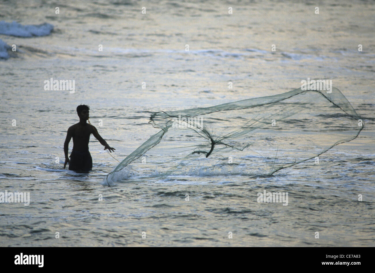 Local fisherman using a cast net, Kalutara beach, Sri Lanka Stock Photo -  Alamy