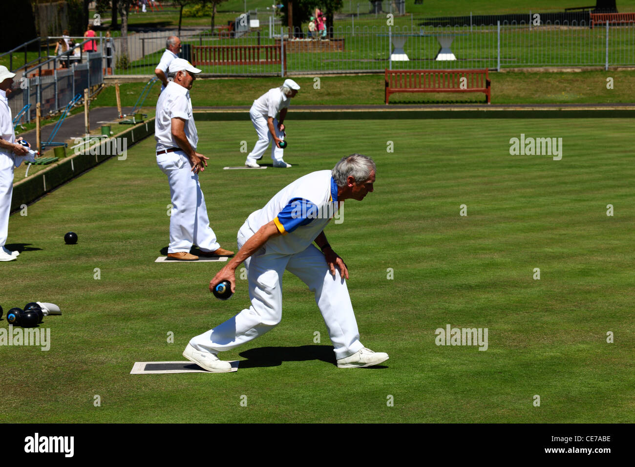 Man bowling during a game of bowls , Southborough Common , Tunbridge Wells , Kent , England Stock Photo