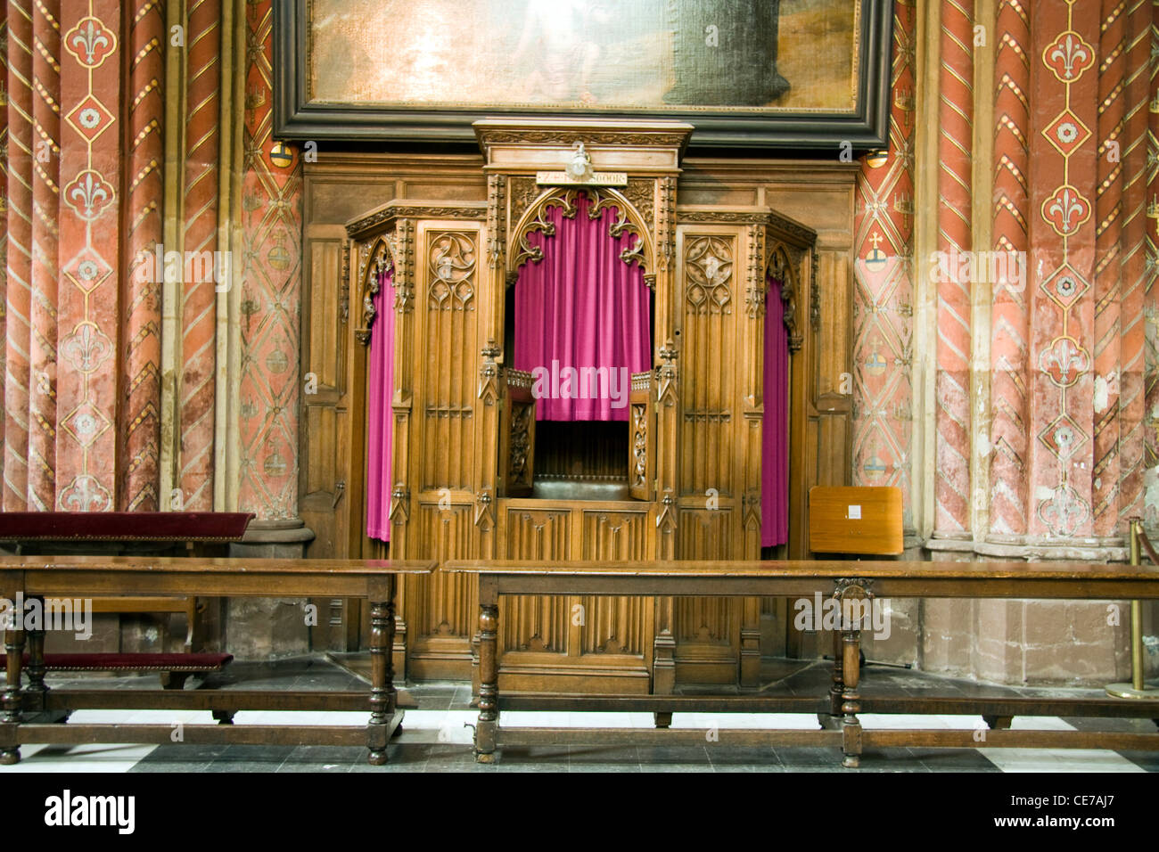 confessional inside an old chruch in Bruges in Belgium Stock Photo