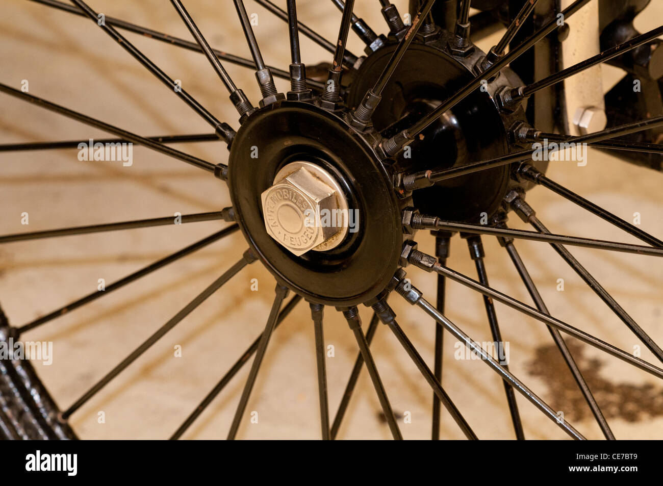 Old Peugeot car wheel. Stock Photo