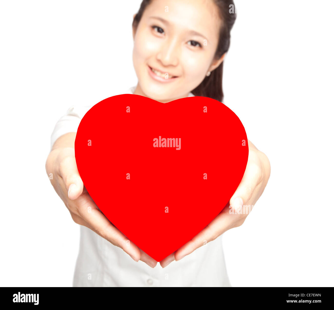 young woman holding red heart symbol Stock Photo - Alamy