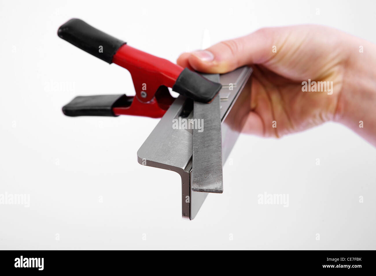 hand holding race ski edge tuning side bevel guide, file and clamp