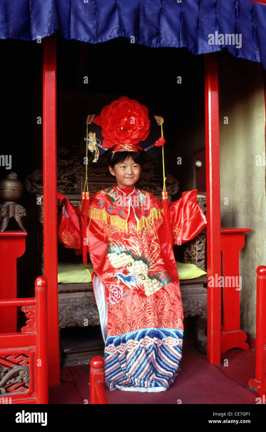 Young Chinese Girl Wearing Qing Dynasty Style Wedding Dress In