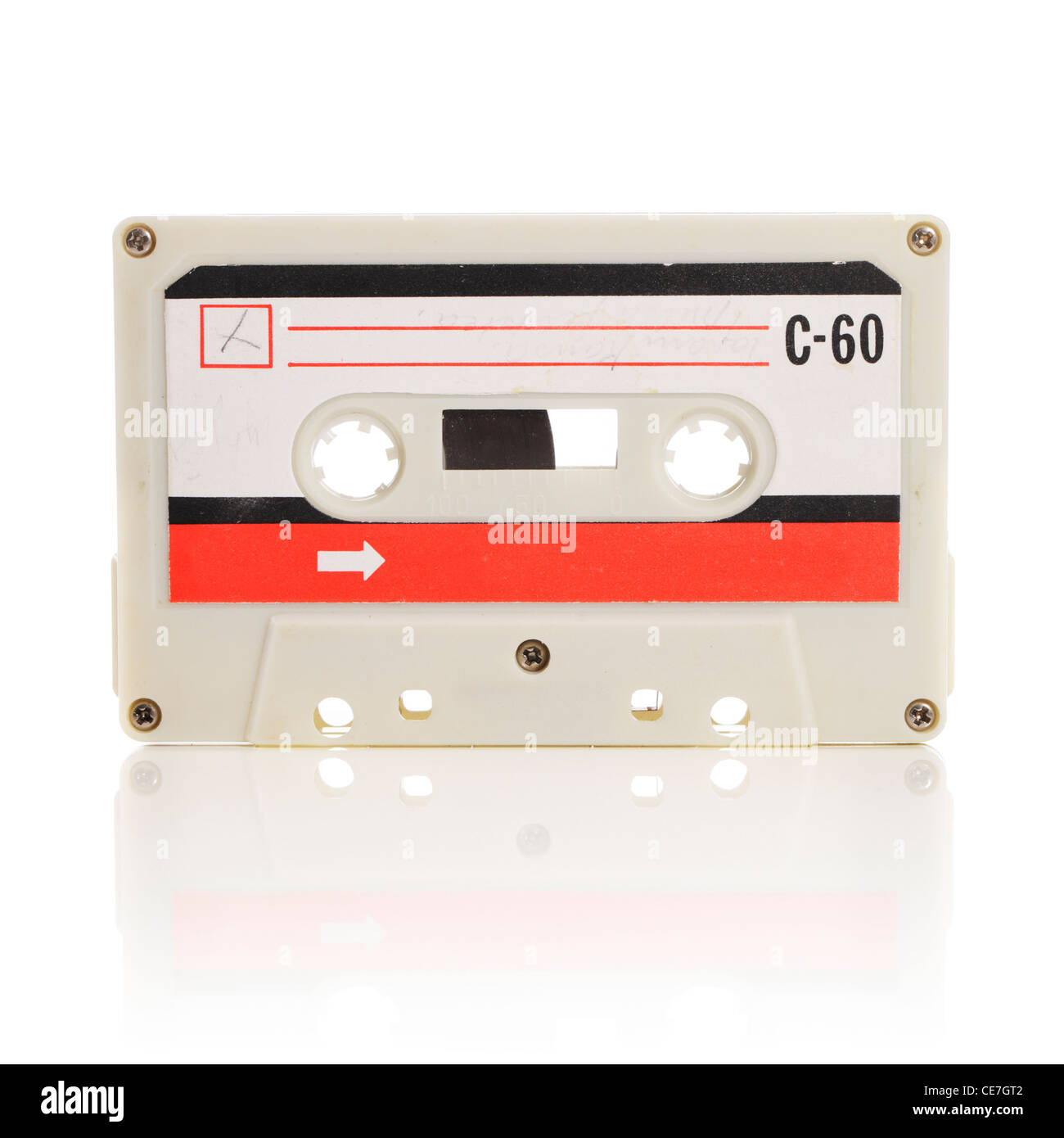 Old compact cassette audio tape isolated on white with natural reflection. Stock Photo