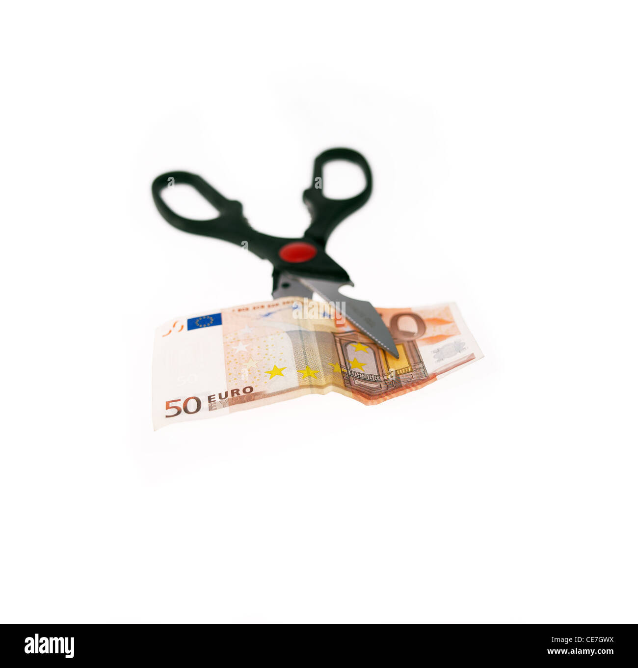 opened stainless scissors cutting euro bill crisis metaphore closeup isolated on white Stock Photo