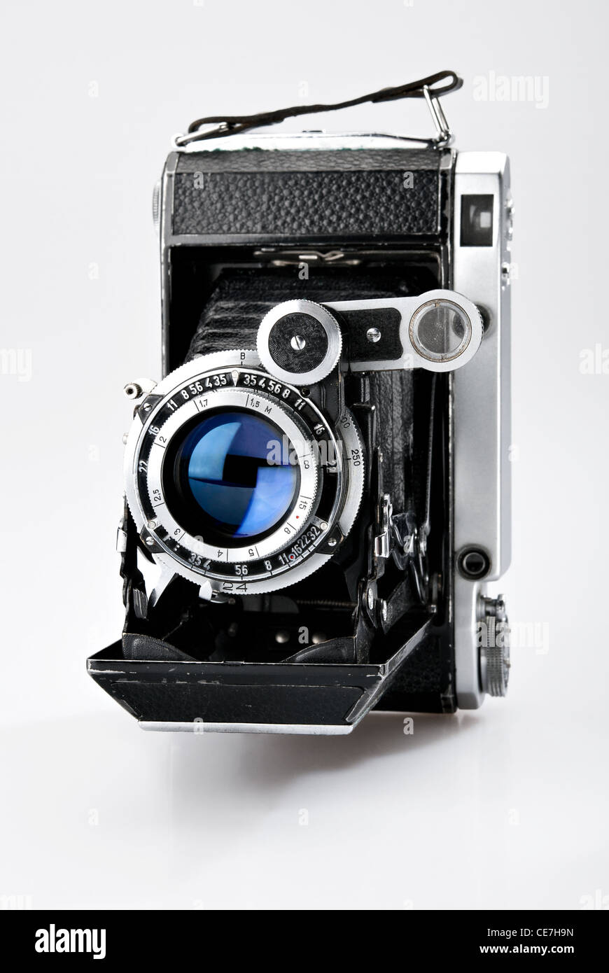Old vintage photo camera isolated on white background Stock Photo - Alamy