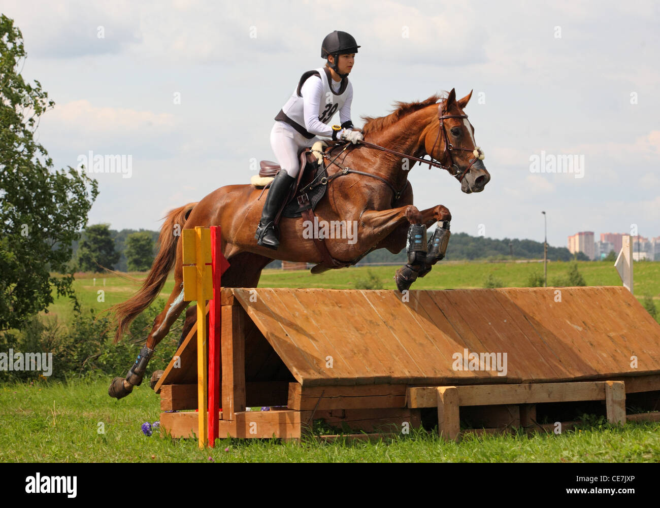 Horse and rider jumping an obstacle at a three day Eventing Competition ...