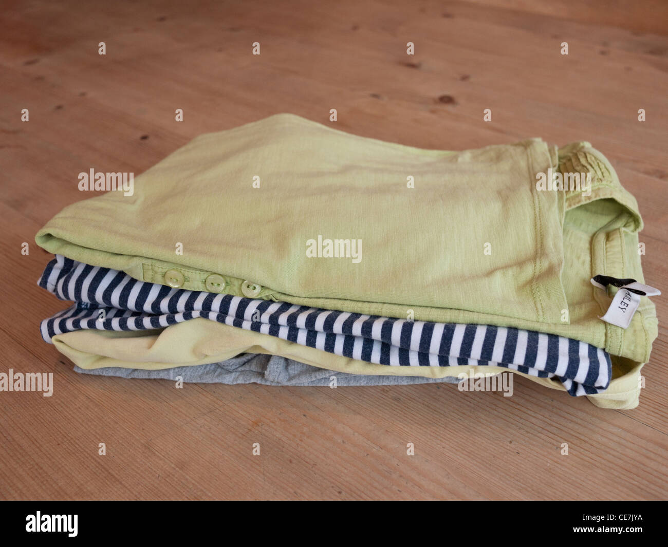Pile neatly ironed cotton clothes hires stock photography and images