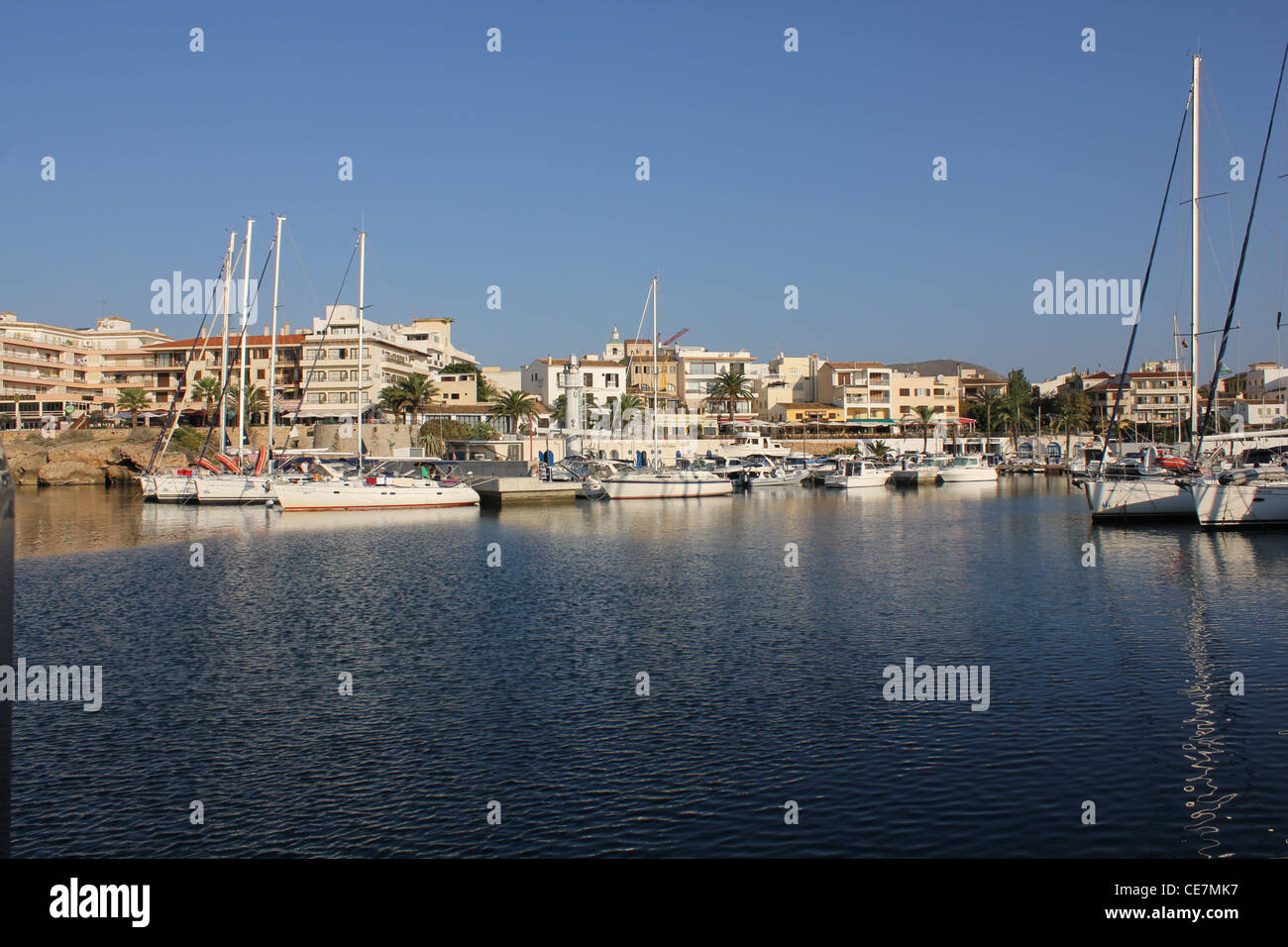 Cala Ratjada / Cala Rajada, sailing boats in marina / port + port side restaurants and hotels / apartments - North East Mallorca Stock Photo