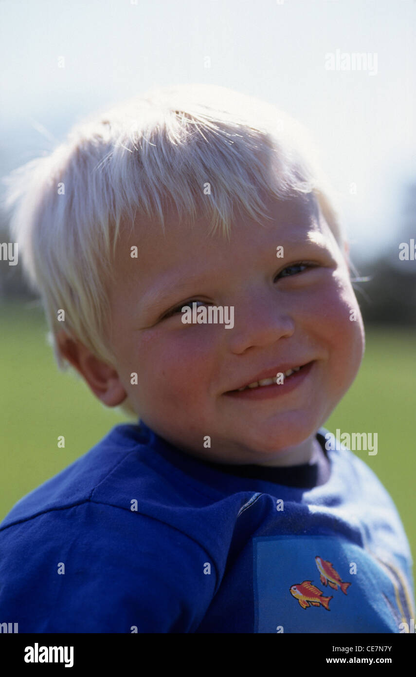 Portrait of a young boy smiling Stock Photo - Alamy