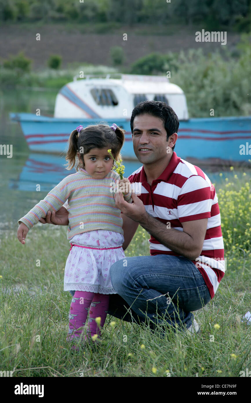 Kurdish father and daughter near Lake Ataturk, Kahta, southeastern Turkey Stock Photo