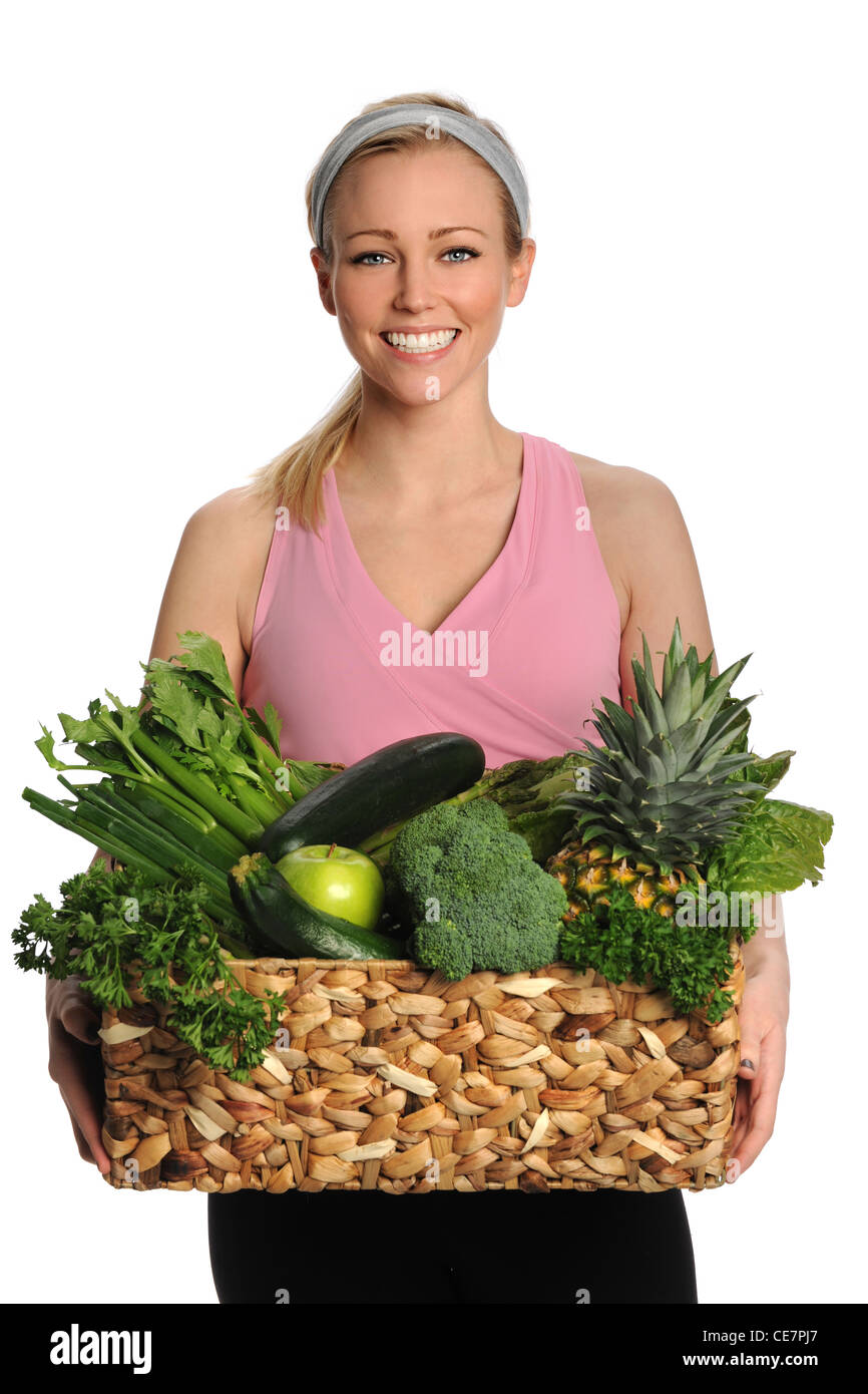 Portrait of beautiful young woman holding fresh fruits and vegetables ...