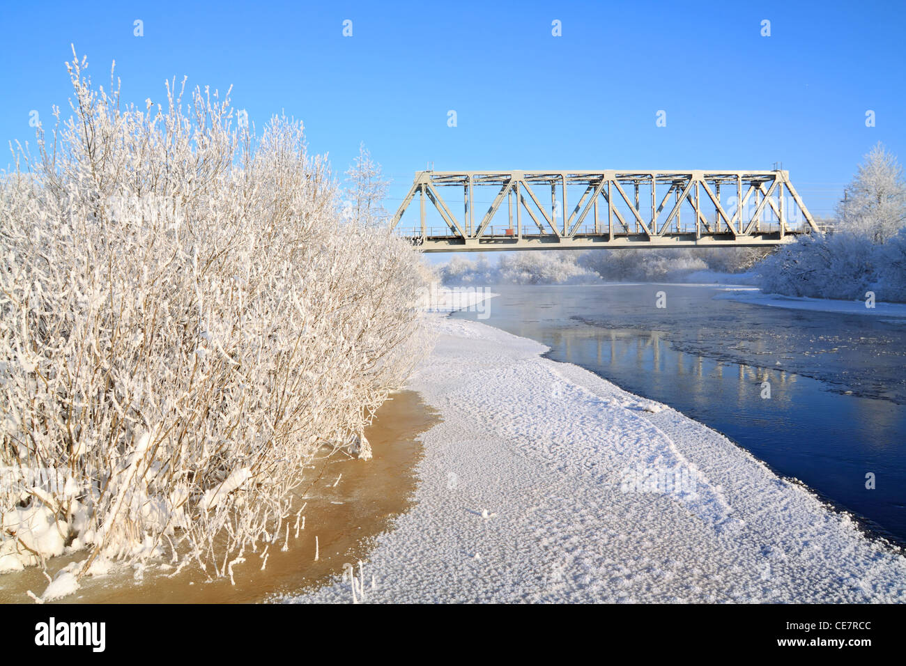 railway bridge on winter river Stock Photo