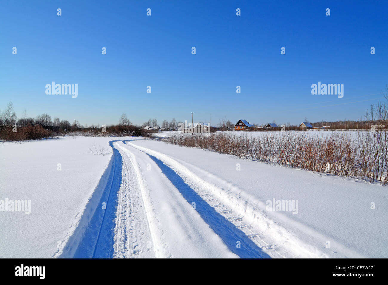 snow road near winter of the villages Stock Photo
