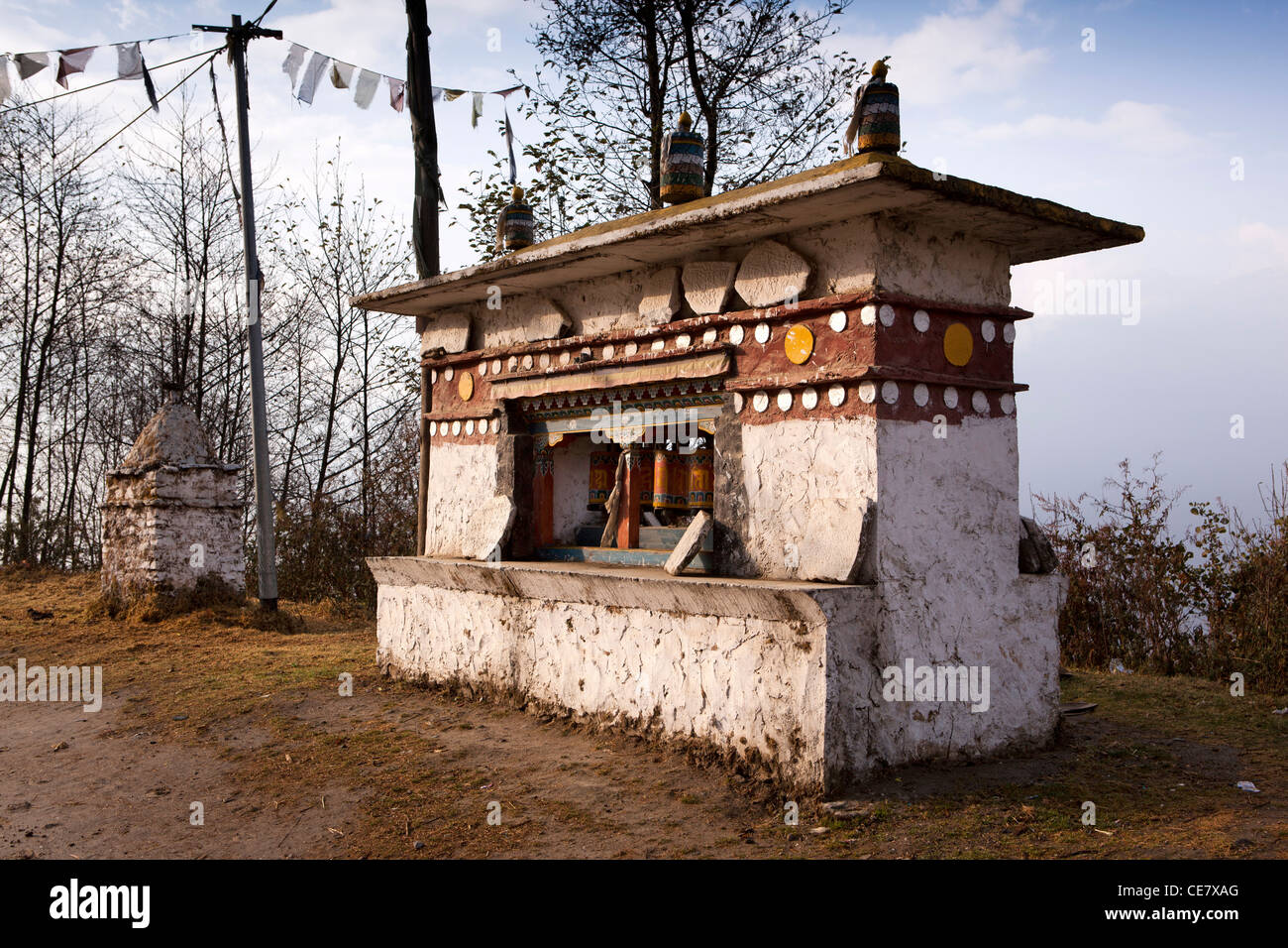 India, Arunachal Pradesh, Tawang Valley, roadside prayer wheels and mani stones at foot of Sela Pass Stock Photo