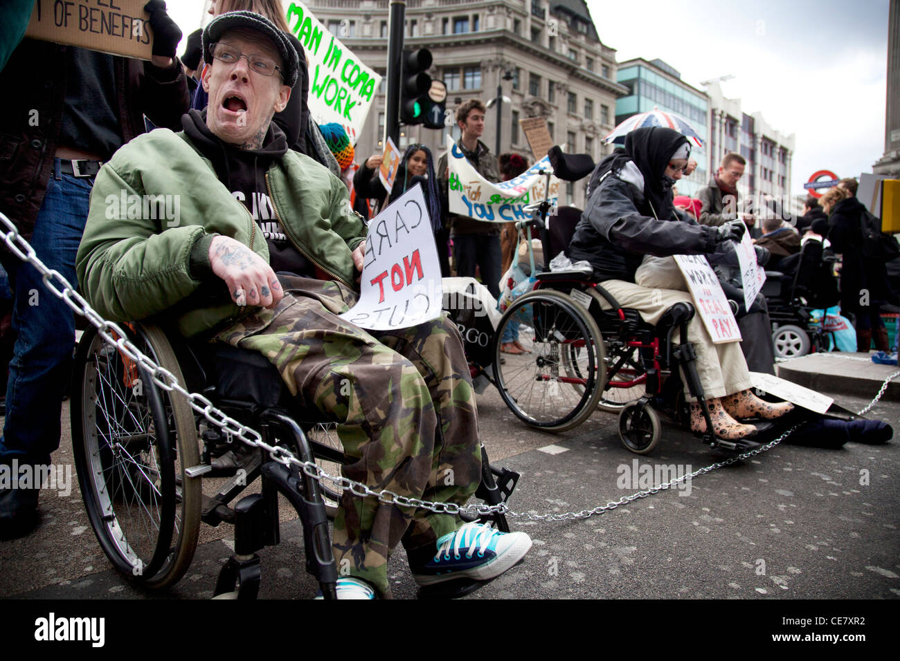 Disabled & able bodied demonstrators block Oxford Circus in central London. Protesting against the Cuts and Welfare Reform Bill. Stock Photo