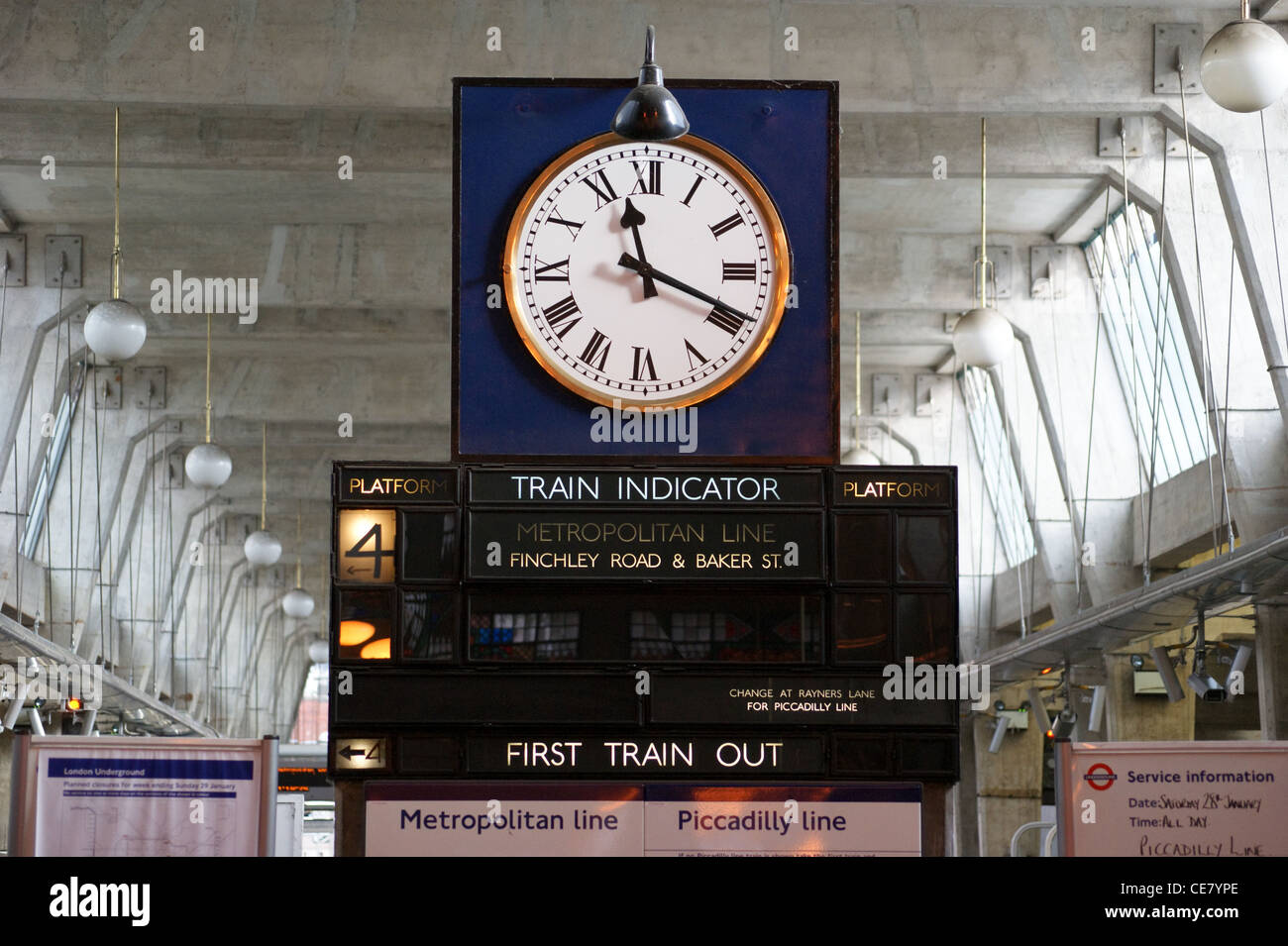 Clock and train indicator, Uxbridge Underground (Tube) station on the Metropolitan Line,  Middlesex, London, England Stock Photo