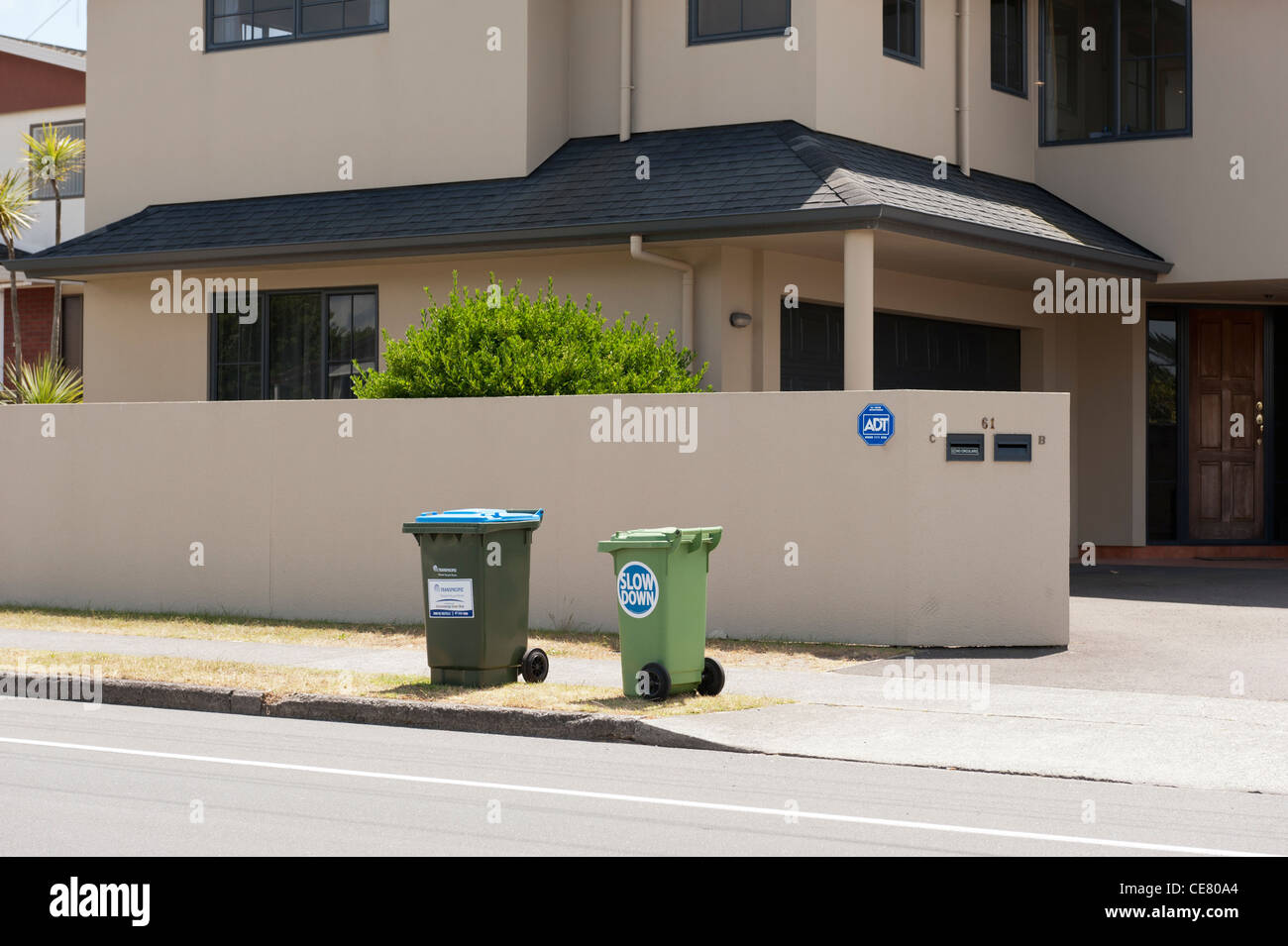 Rubbish bin with road safety (slow down) sticker in Tauranga, Bay of