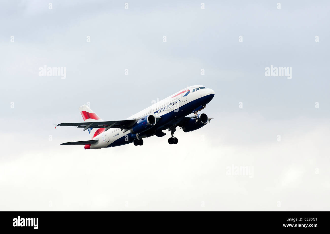 British Airways Airbus A319-131 Airliner G-EUPA Taking Off From Manchester International Airport in Rain England United Kingdom Stock Photo