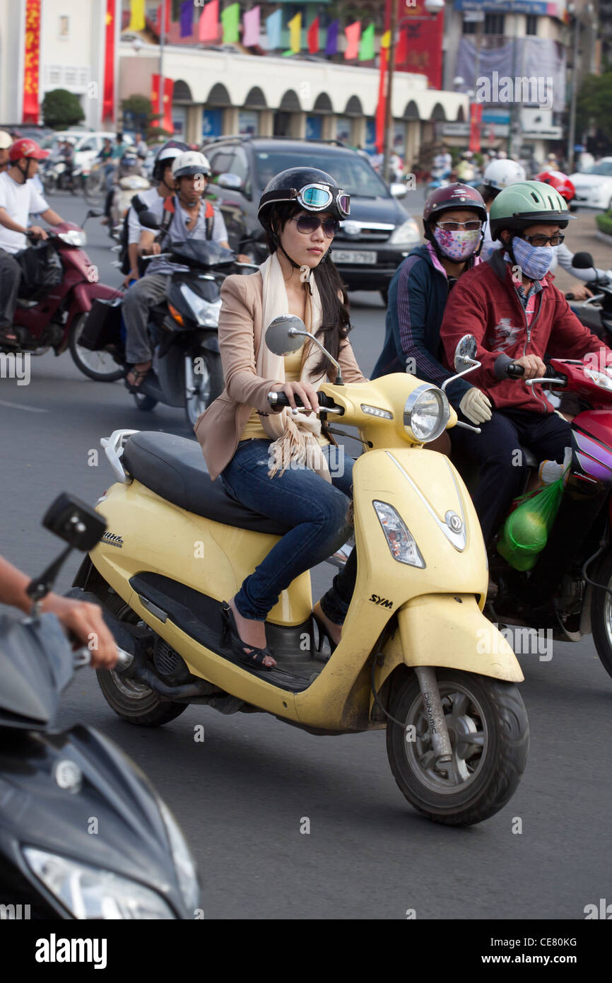 Smart young woman on scooter in downtown Ho Chi Minh Vietnam Stock Photo Alamy