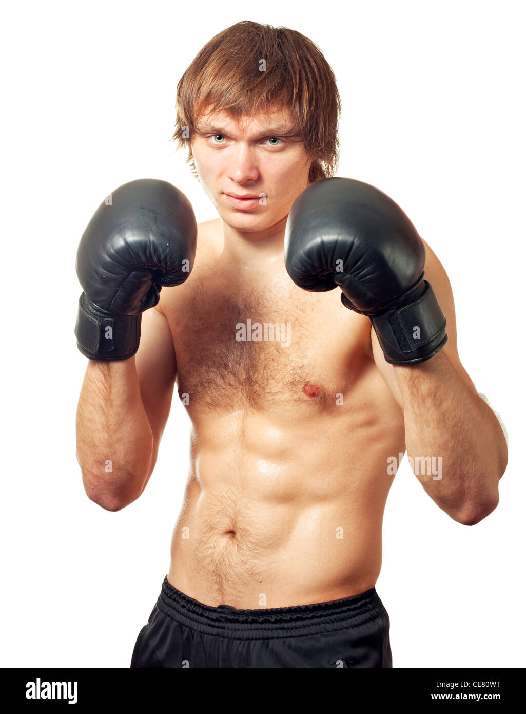 Young caucasian man boxer with black boxing gloves on white background