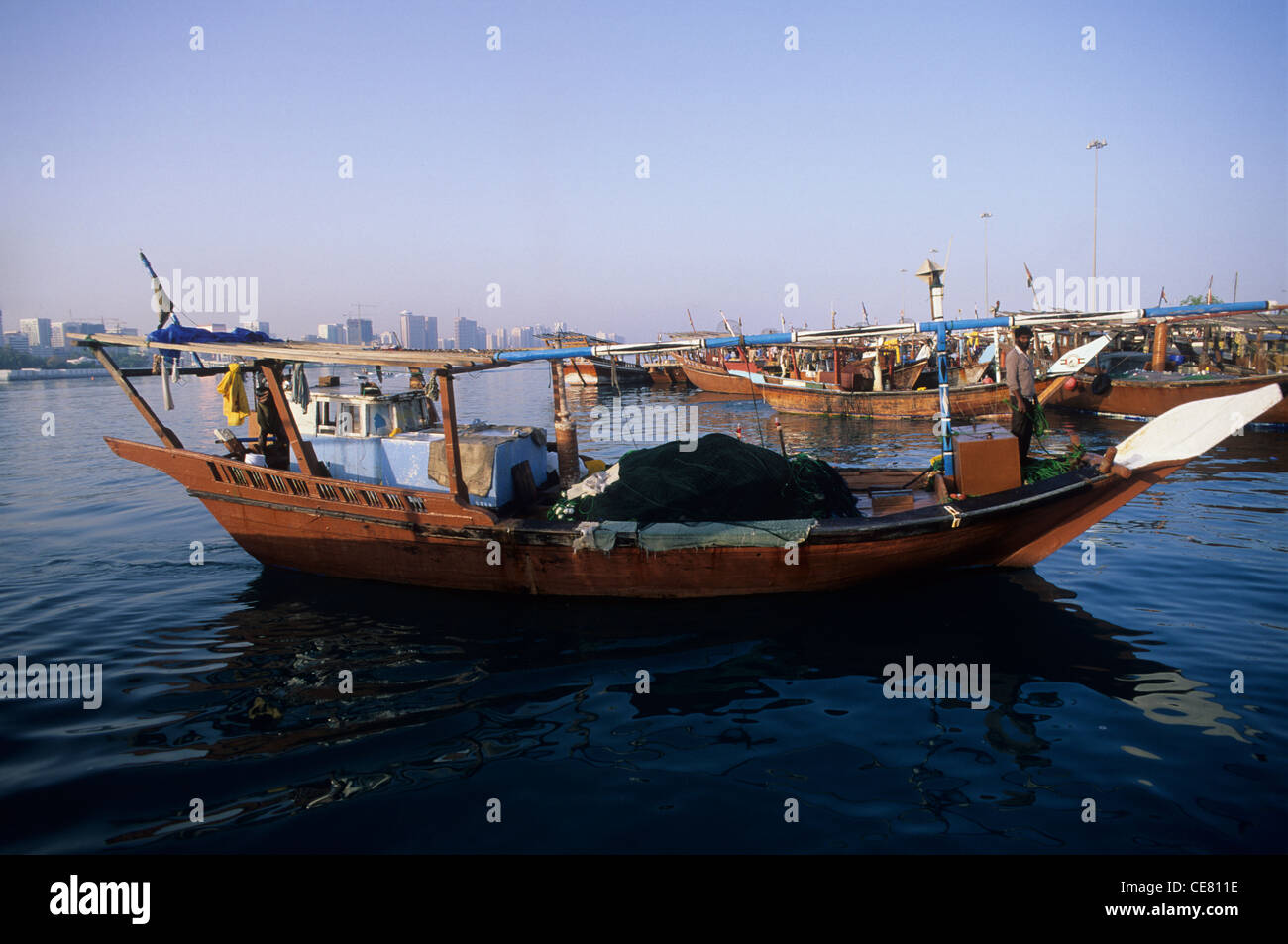 Abu Dhabi, the fish market area with traditional fishing Dhows and city