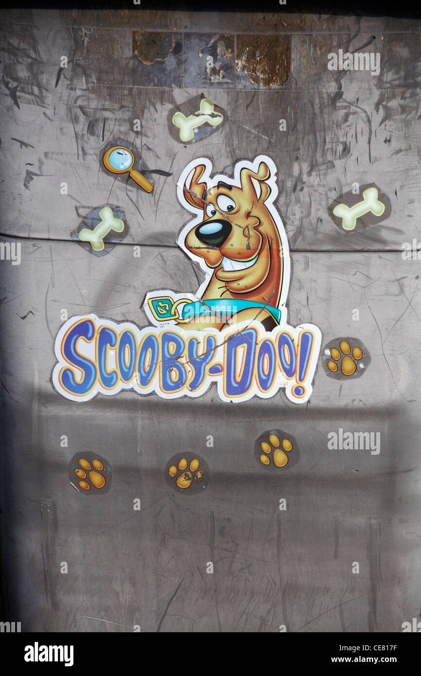 Scooby Doo stickers on side of black wheely bin Stock Photo