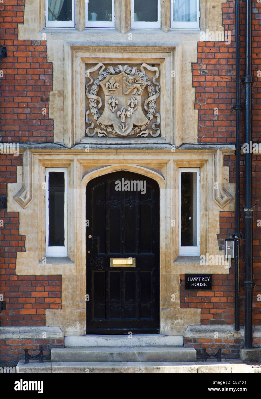 Front door of Hawtrey House, a boys' house at Eton College, with the school coat of arms above Stock Photo