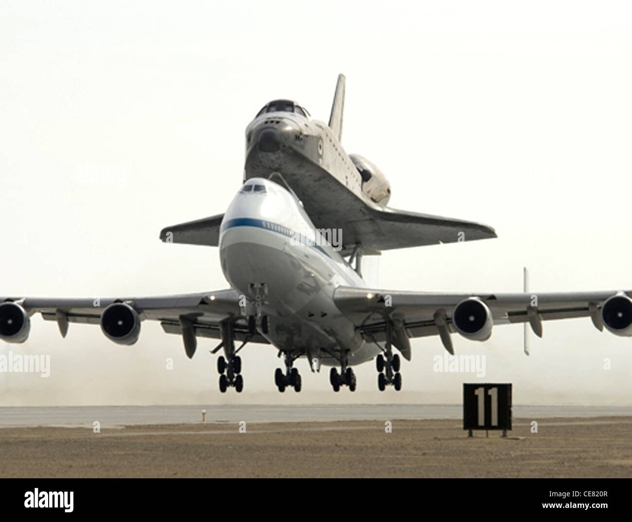 Space Shuttle Atlantis is carried on a NASA-modified Boeing 747 off Runway 22 at Edwards Air Force Base in California on the first leg of the ferry flight back to the Kennedy Space Center in Florida June 1. Stock Photo
