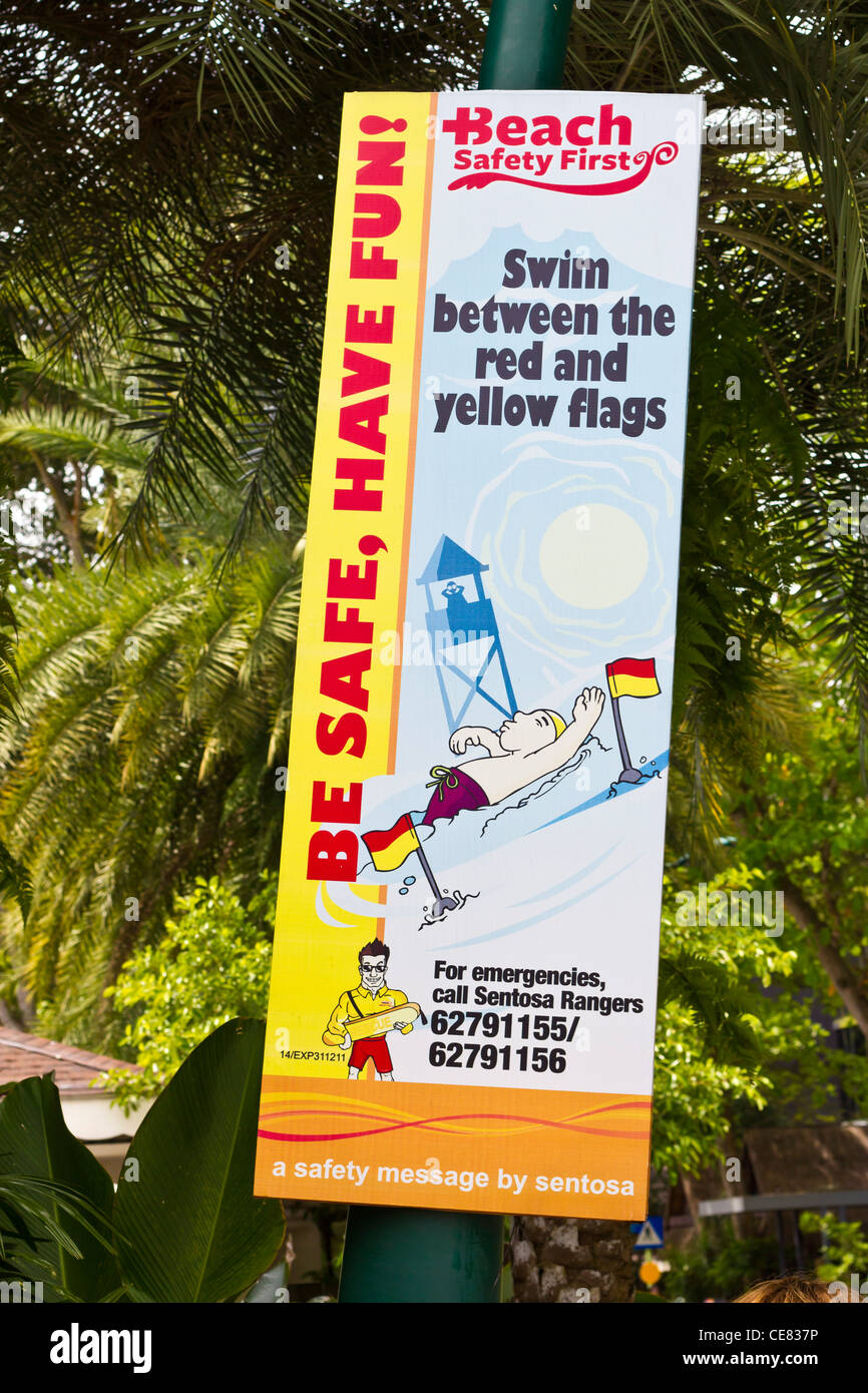 Swim safely sign swim between flags at Sentosa Island Singapore Stock Photo