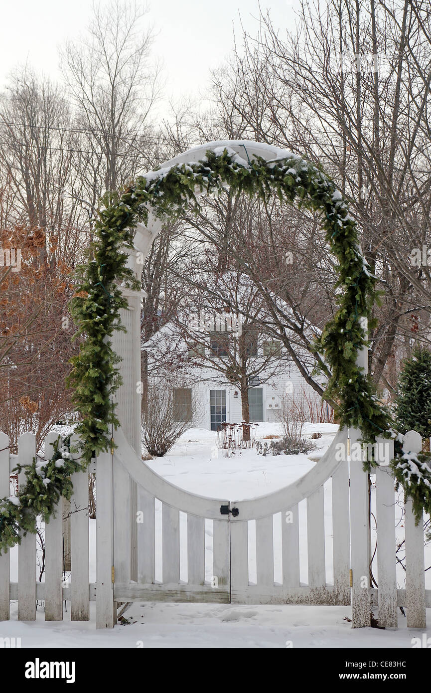 Garland decorating a gate in winter Stock Photo