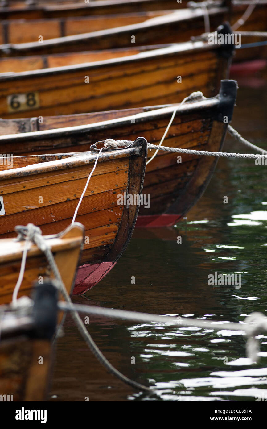 The bows of several rowing boats lined up on the dock in Bowness-on-Windermere Stock Photo