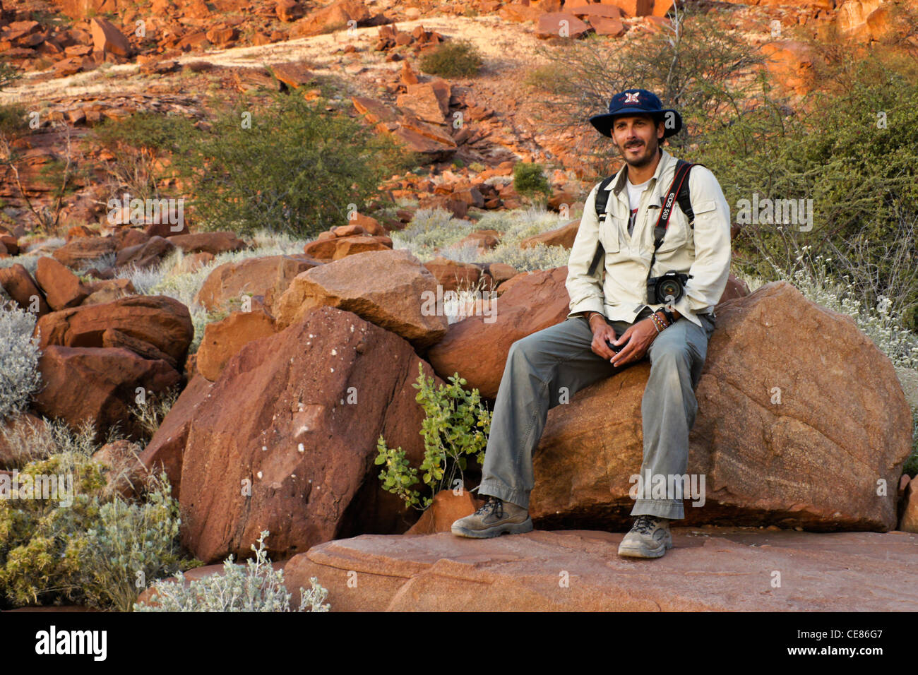 Hiker visiting San rock art site, Twyfelfontein, Namibia Stock Photo